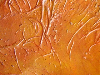 Orange Texture - closeup of painted paper mache.