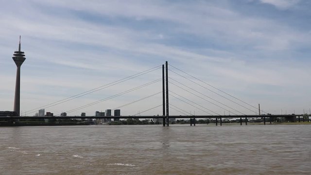 Rhine Tower and Rheinknie bridge in D&uuml;sseldorf at River Rhine, Germany