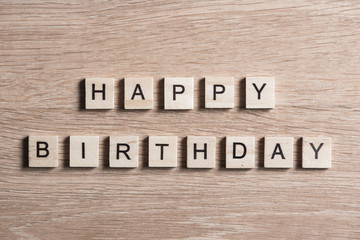 wooden elements with letter collected to word happy birthday