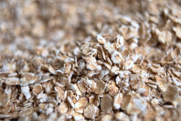 dry rolled pile of oats closeup. Deep blur and bokeh