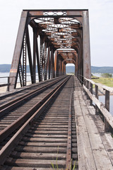 Iron and wooden railroad tressle bridge in Quebec, Canada.