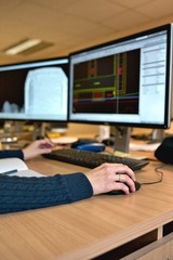 Woman's hand holding a mouse for office design work. Female arch