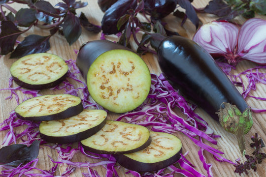 Sliced eggplant, purple onion and sliced purple cabbage