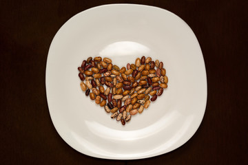 plate with beans in the shape of heart