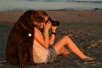 THE YOUNG PHOTOGRAPHER AND HER LABRADOR