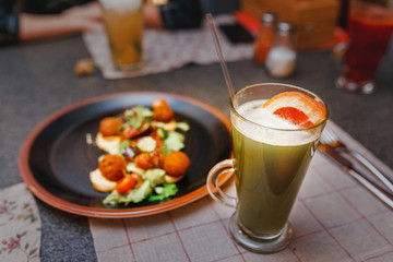 set the table in an elegant restaurant with delicious falafel and fresh cocktail