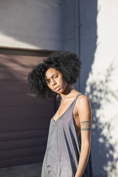 Portrait of young woman standing outdoors