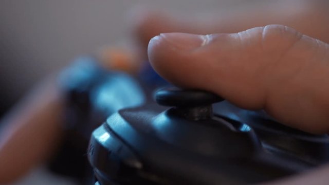 Young man holding game controller.