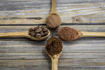 beautiful little wooden spoon with coffee on  background