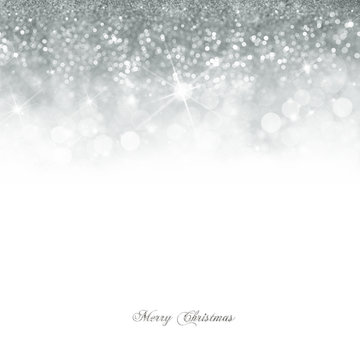 Christmas card with Bright silver bokeh background