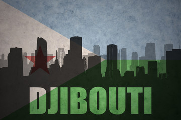 Fototapeta premium abstract silhouette of the city with text djibouti at the vintage djibouti flag