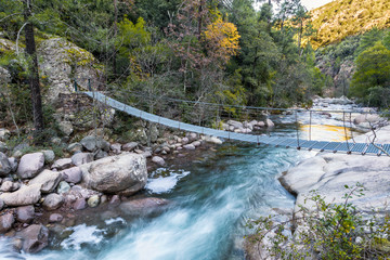 Steel rope bridge across La Figarella at Bonifatu in Corsica