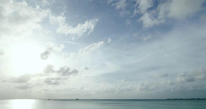 timelapse of clouds moving over the caribbean sea near sunset