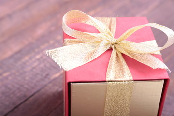 Gift boxes with bow on wood background