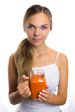 Woman holding a carrot juice diet is a healthy diet smiling helpful