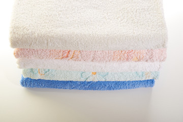stack of towels on a white background