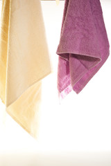 towels hanging on a white background