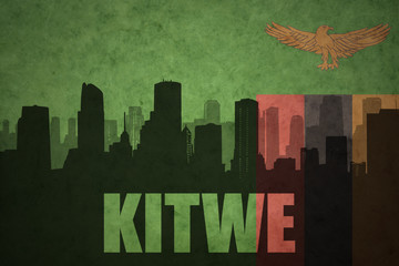 abstract silhouette of the city with text Kitwe at the vintage zambian flag