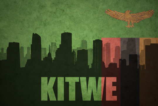 abstract silhouette of the city with text Kitwe at the vintage zambian flag