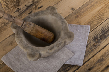 Pestle and mortar on table