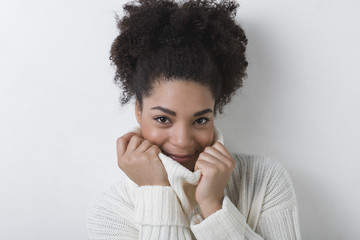Fototapeta na wymiar Portrait of young woman in white sweater