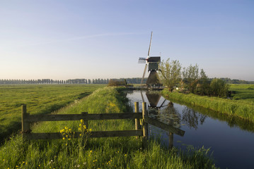 Gate in front of a windmill
