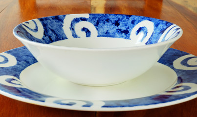 Bowl and plate on table