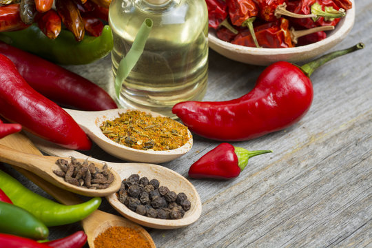 fresh red, yellow and green chilli on old wood background. selective focus image, space for advertising text  