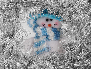 snowman with a blue scarf and red nose
