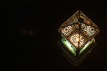 Close-up view on lantern in a dark background