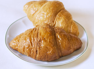 Croissants  on white plate.