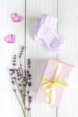 baby accessories with lavender for the bathroom on wooden background
