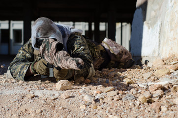 Sniper aim target with scope kneeling position 