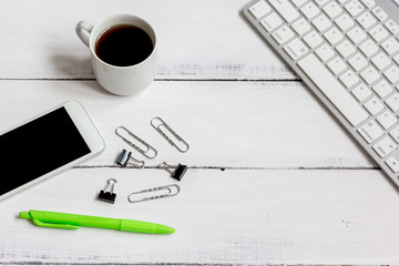 mans working place at wooden desktop with coffee