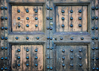 Details of an ancient Italian door in Florence, Italy.