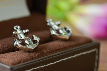 Groom cufflinks shaped anchor on the box