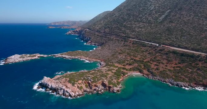 flying above road by seashore