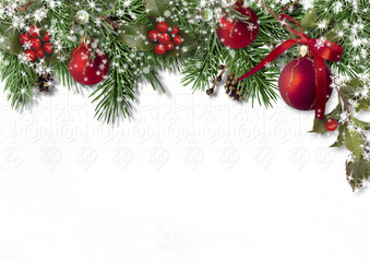 Christmas card with fir branches, balls and holly on white background