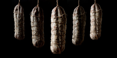 Italian salami seasoned black background