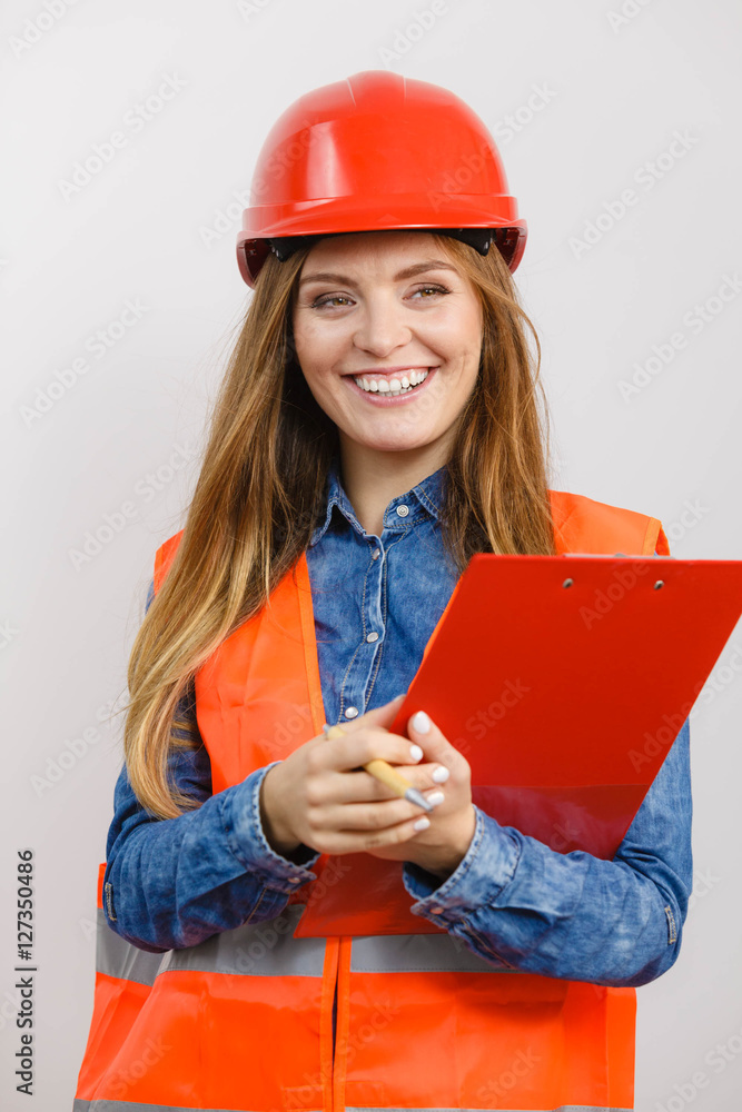 Wall mural woman engineer construction builder in helmet.