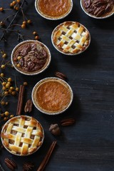 Top down view of 3 different pies - apple pie pumpkin pie and Pecan pie - obrazy, fototapety, plakaty