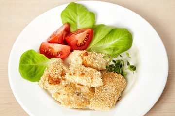 roasted fish fillet covered with sesame seeds