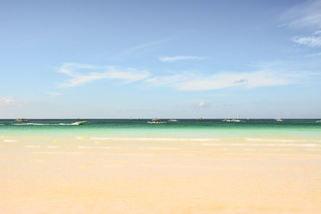 Fototapeta na wymiar View of a beach and the sea of Boracay island in Philippines wit