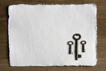 Skeleton Key and Watercolor Paper on Wood