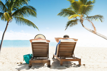 Couple Enjoying Vacation On Beach