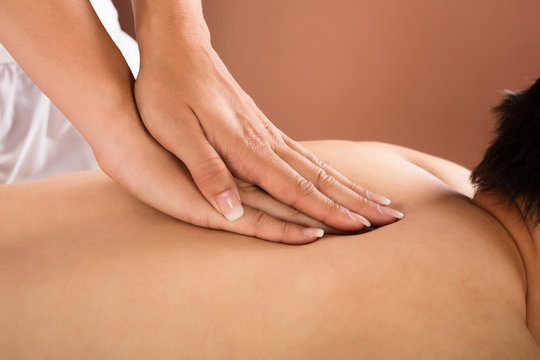 Close-up Of A Man Receiving Back Massage