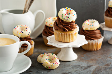 Cupcakes with chocolate frosting and little donuts