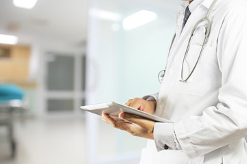 Doctor using a digital tablet