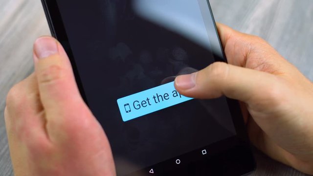 Get app button pressed on a black tablet device