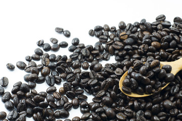 Coffee Beans in wooden spoon isolated on white